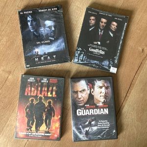 Four DVD movies New and sealed are Heat and Goodfellas Ablaze and Guardian used.